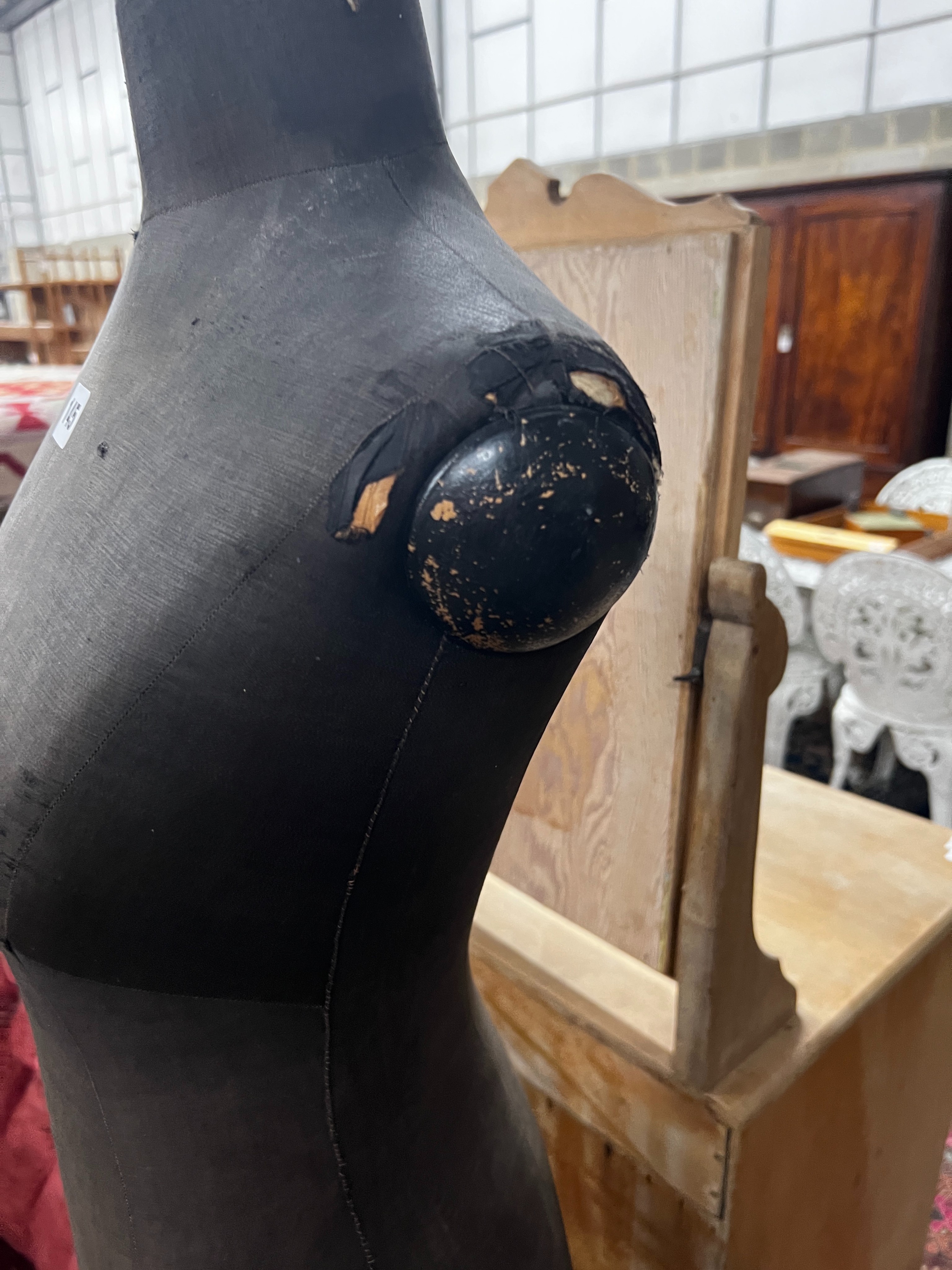 A vintage ebonised telescopic tailor's dummy on tripod stand